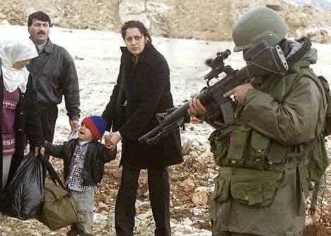 Israel Soldier pointing gun at a terrified child